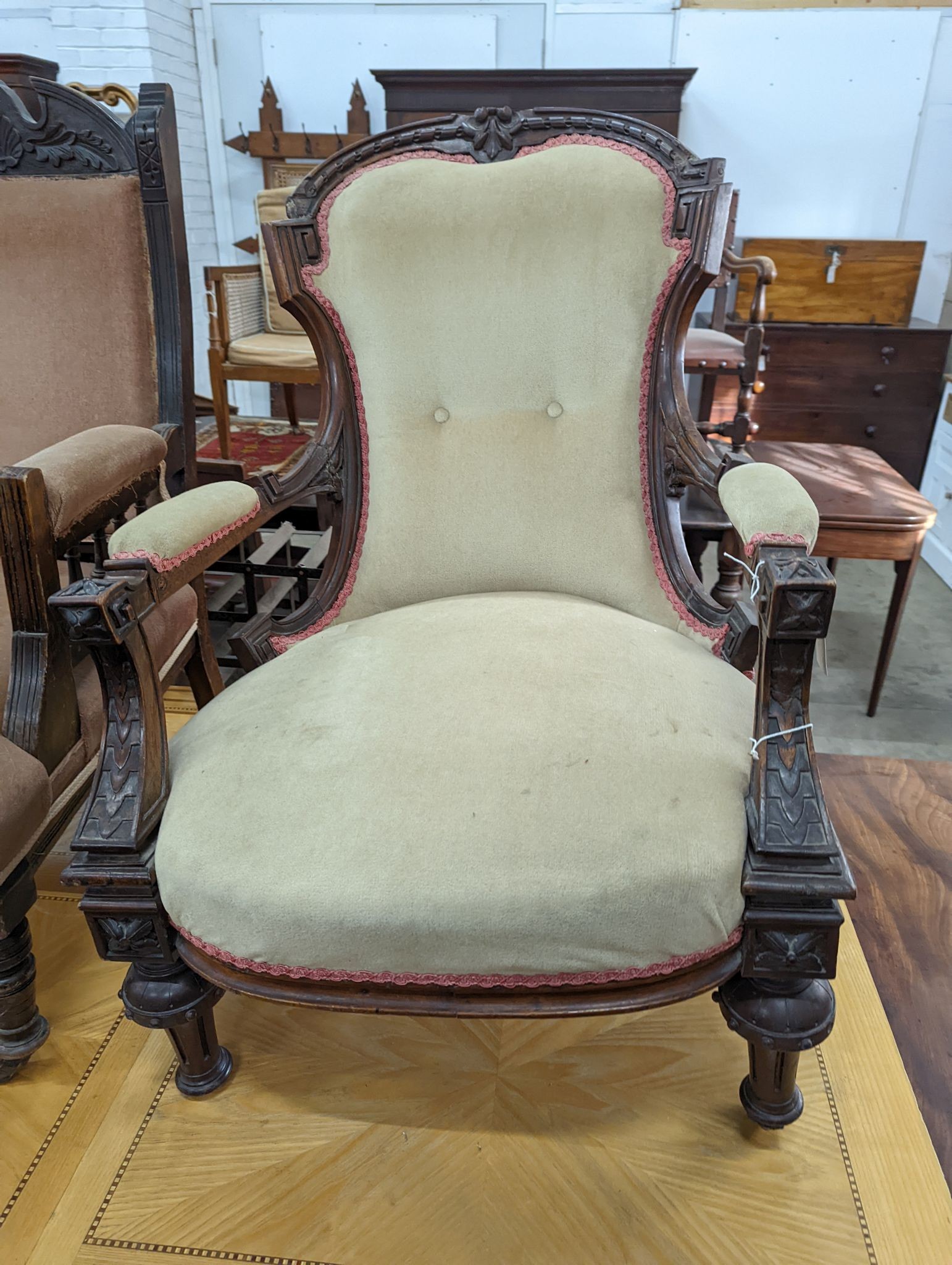 Two Victorian mahogany upholstered open armchairs